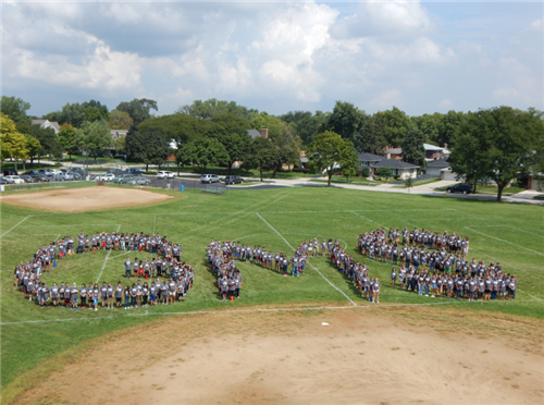 Gurrie School Students Spelling GMS Outside 